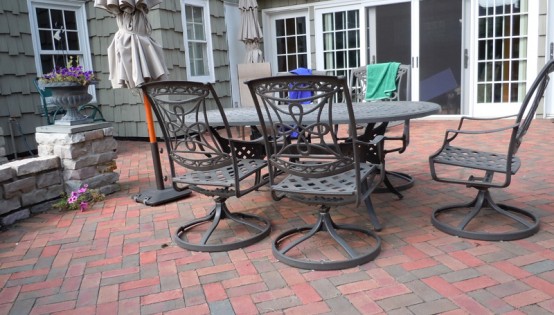 Clay paving stone patio with chilton stone wall in Minneapolis